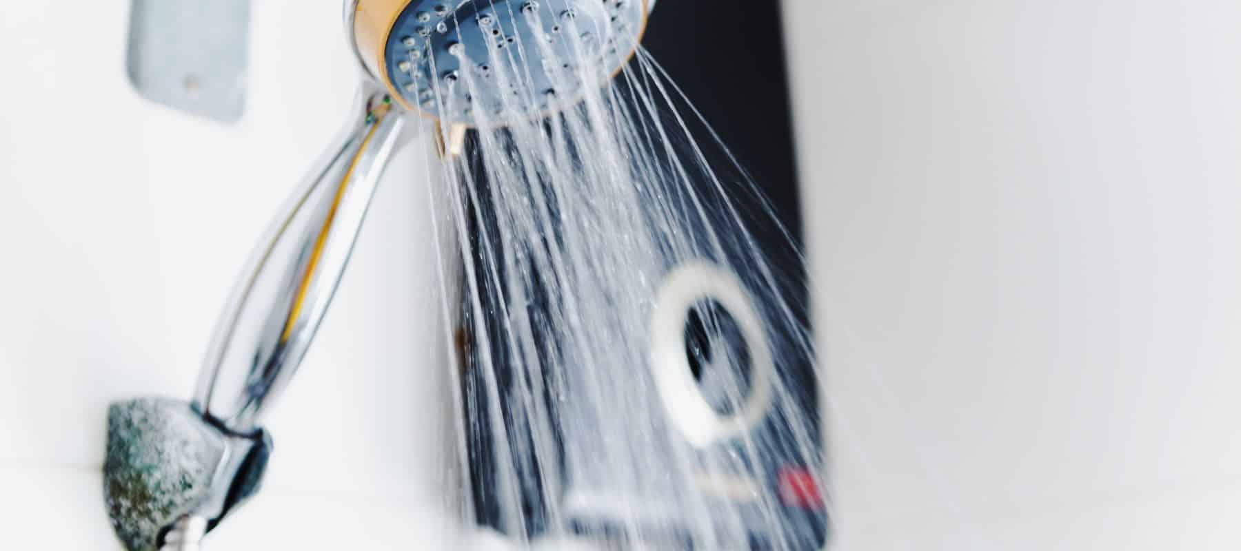 hot water streaming out from detachable shower head