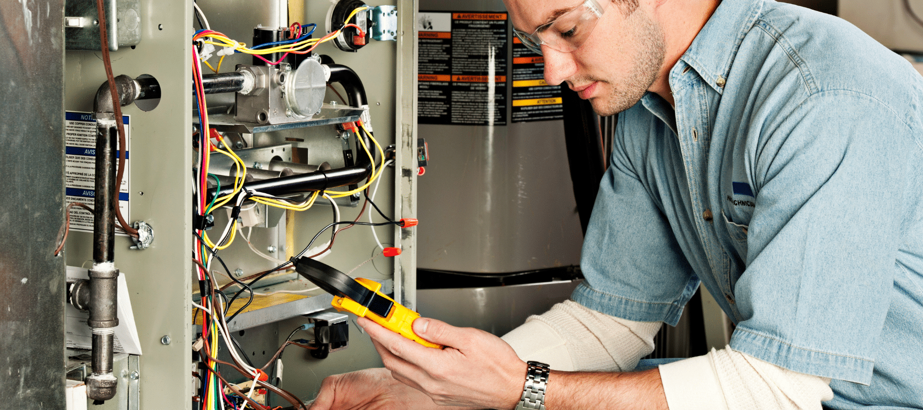 hvac technician performing furnace maintenance